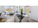 Cozy living area next to dining area featuring a fireplace, large window, and modern decor at 337 Pine Ne St # B, Atlanta, GA 30308