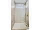 Modern shower features neutral tile, glass enclosure, and elegant gold hardware at 337 Pine Ne St # B, Atlanta, GA 30308