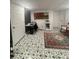 Finished basement area with decorative rug and tile flooring at 4909 Glenwhite Dr, Duluth, GA 30096