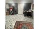 Finished basement area with decorative rug and tile flooring at 4909 Glenwhite Dr, Duluth, GA 30096