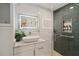 Modern bathroom with a glass-enclosed shower, tiled walls, and a vessel sink vanity at 4909 Glenwhite Dr, Duluth, GA 30096