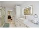 Bright bathroom featuring a sleek vanity with marble countertop and luxurious walk-in shower at 4909 Glenwhite Dr, Duluth, GA 30096