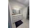 Bright bathroom features a large vanity with marble countertops, ample storage, and modern fixtures at 4909 Glenwhite Dr, Duluth, GA 30096