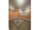 This bedroom features an area rug, neutral paint, and a window with natural light at 4909 Glenwhite Dr, Duluth, GA 30096