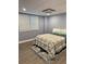 Inviting bedroom with wood floors, bright windows, and a cozy bed adorned with a stylish comforter and decorative rug at 4909 Glenwhite Dr, Duluth, GA 30096