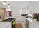 Modern kitchen featuring white cabinetry, stainless steel appliances, marble countertops, and gold hardware at 4909 Glenwhite Dr, Duluth, GA 30096