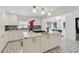 Bright, modern kitchen with white cabinets, marble countertops, tiled backsplash, and stainless steel appliances at 4909 Glenwhite Dr, Duluth, GA 30096