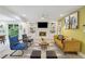 Spacious living room featuring a fireplace, built-in shelving, and comfortable seating arrangement at 4909 Glenwhite Dr, Duluth, GA 30096