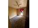 Bedroom with carpet, ceiling fan, and natural light from a window at 2436 Rex Rd, Ellenwood, GA 30294
