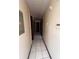 Tiled hallway with multiple doors and natural light at 2436 Rex Rd, Ellenwood, GA 30294