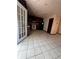 Kitchen area with tiled floor, white appliances, and dark cabinetry at 2436 Rex Rd, Ellenwood, GA 30294