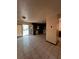Kitchen area with tiled floor, white appliances, dark cabinetry, and a sliding glass door at 2436 Rex Rd, Ellenwood, GA 30294