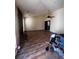 Living room with hardwood floors, ceiling fan, fireplace, and natural light at 2436 Rex Rd, Ellenwood, GA 30294