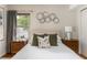 Comfortable bedroom featuring neutral tones, stylish decor, and ample natural light from the window at 2685 Flagstone Se Dr, Atlanta, GA 30316