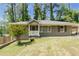 Charming single-story home with a well-maintained front yard, covered porch and a convenient covered carport at 2685 Flagstone Se Dr, Atlanta, GA 30316