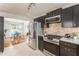 Well-equipped kitchen with stainless steel appliances, granite countertops, and dark cabinetry at 2685 Flagstone Se Dr, Atlanta, GA 30316