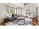 Bright living room features hardwood floors, a large window, and a neutral color palette at 2685 Flagstone Se Dr, Atlanta, GA 30316
