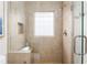 Shower with glass block window, tiled surround and glass door at 2685 Flagstone Se Dr, Atlanta, GA 30316