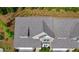 An aerial view shows the roof of this townhouse, surrounded by well-maintained landscaping at 2706 Park Land Ln, Snellville, GA 30078