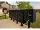 A row of black mailboxes with assigned numbers stand ready for community correspondence at 2706 Park Land Ln, Snellville, GA 30078