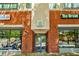 Apartment building entrance with retail shops on each side at 335 W Ponce De Leon Ave # 308, Decatur, GA 30030