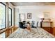 Dining room features a modern rug, table set, and natural light from a large window at 335 W Ponce De Leon Ave # 308, Decatur, GA 30030