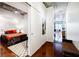 Hallway leading to bedroom with concrete ceiling, ceiling fan, and modern decor at 335 W Ponce De Leon Ave # 308, Decatur, GA 30030
