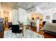 Open-concept living and dining area with modern decor and exposed concrete ceiling at 335 W Ponce De Leon Ave # 308, Decatur, GA 30030