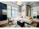 Bright and airy living room with comfortable seating, large window and modern decor at 335 W Ponce De Leon Ave # 308, Decatur, GA 30030