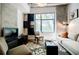 Cozy living room with modern furniture, large window, and ample natural light at 335 W Ponce De Leon Ave # 308, Decatur, GA 30030