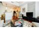 Open concept living room with breakfast bar, flat screen television and modern decor at 335 W Ponce De Leon Ave # 308, Decatur, GA 30030