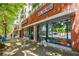 Apartment building exterior with nearby retail shopping at 335 W Ponce De Leon Ave # 308, Decatur, GA 30030
