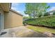 Backyard with a concrete patio and well-maintained landscaping at 3366 Thornbridge Dr, Powder Springs, GA 30127