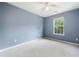 Bright bedroom with large window and plush carpet at 3366 Thornbridge Dr, Powder Springs, GA 30127