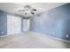 Bedroom featuring neutral carpet, ceiling fan, closet, and attached bathroom at 3366 Thornbridge Dr, Powder Springs, GA 30127