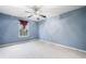 Bright bedroom with carpet, a window and blue walls at 3366 Thornbridge Dr, Powder Springs, GA 30127