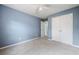 Bright bedroom featuring neutral carpet, ceiling fan, and closet at 3366 Thornbridge Dr, Powder Springs, GA 30127