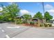 Stone entrance to the Carringtion community with a small pavilion and landscaped grounds at 3366 Thornbridge Dr, Powder Springs, GA 30127