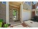 Inviting entryway with brick accents, covered porch, and a convenient attached garage at 3366 Thornbridge Dr, Powder Springs, GA 30127