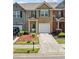 Attractive townhome showcasing well-maintained landscaping and a convenient one-car garage at 3366 Thornbridge Dr, Powder Springs, GA 30127