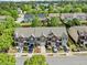Street view of townhomes featuring well maintained landscaping, driveways, and attached garages at 3366 Thornbridge Dr, Powder Springs, GA 30127