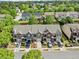Exterior shot of townhomes featuring well manicured lawns and private driveways at 3366 Thornbridge Dr, Powder Springs, GA 30127
