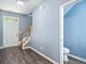 Bright foyer with wood floors, staircase, and a convenient half-bath access at 3366 Thornbridge Dr, Powder Springs, GA 30127