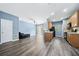 Open concept living area with a kitchen, black appliances, and sliding glass doors at 3366 Thornbridge Dr, Powder Springs, GA 30127