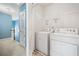 Convenient laundry area with white washer and dryer at 3366 Thornbridge Dr, Powder Springs, GA 30127