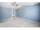 Large main bedroom with vaulted ceiling, carpet flooring, and en-suite bathroom at 3366 Thornbridge Dr, Powder Springs, GA 30127