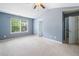 Spacious bedroom with vaulted ceilings and large window at 3366 Thornbridge Dr, Powder Springs, GA 30127