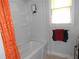 Clean bathroom with a bathtub and shower combination at 770 Starrsville Rd, Covington, GA 30014