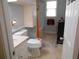 Full bathroom featuring toilet, sink and bathtub at 770 Starrsville Rd, Covington, GA 30014