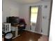 Cozy bedroom with a desk, chair, and window with curtains at 770 Starrsville Rd, Covington, GA 30014